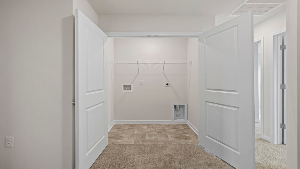 Laundry room with shelving.