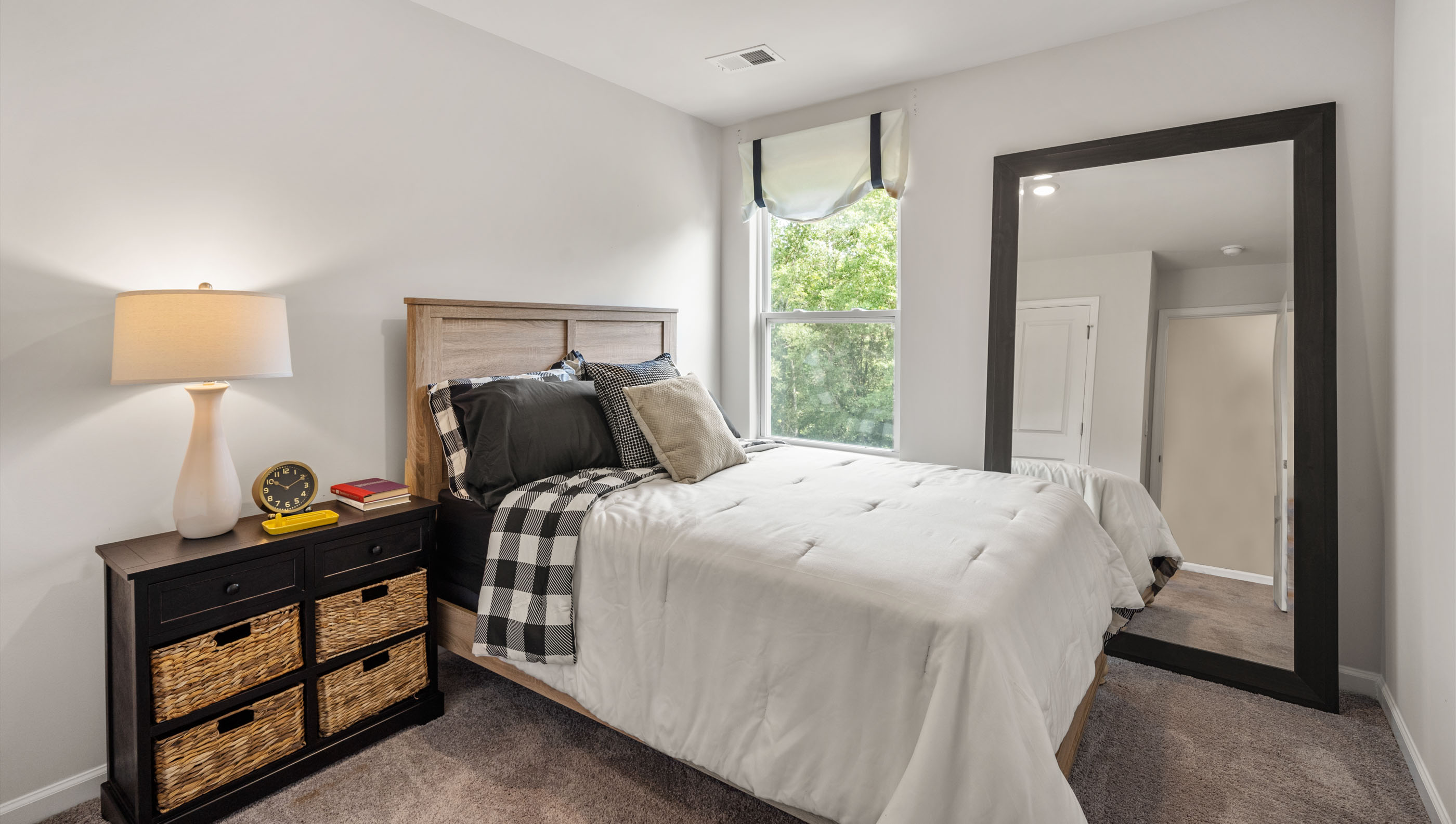 Bedroom with carpet and window
