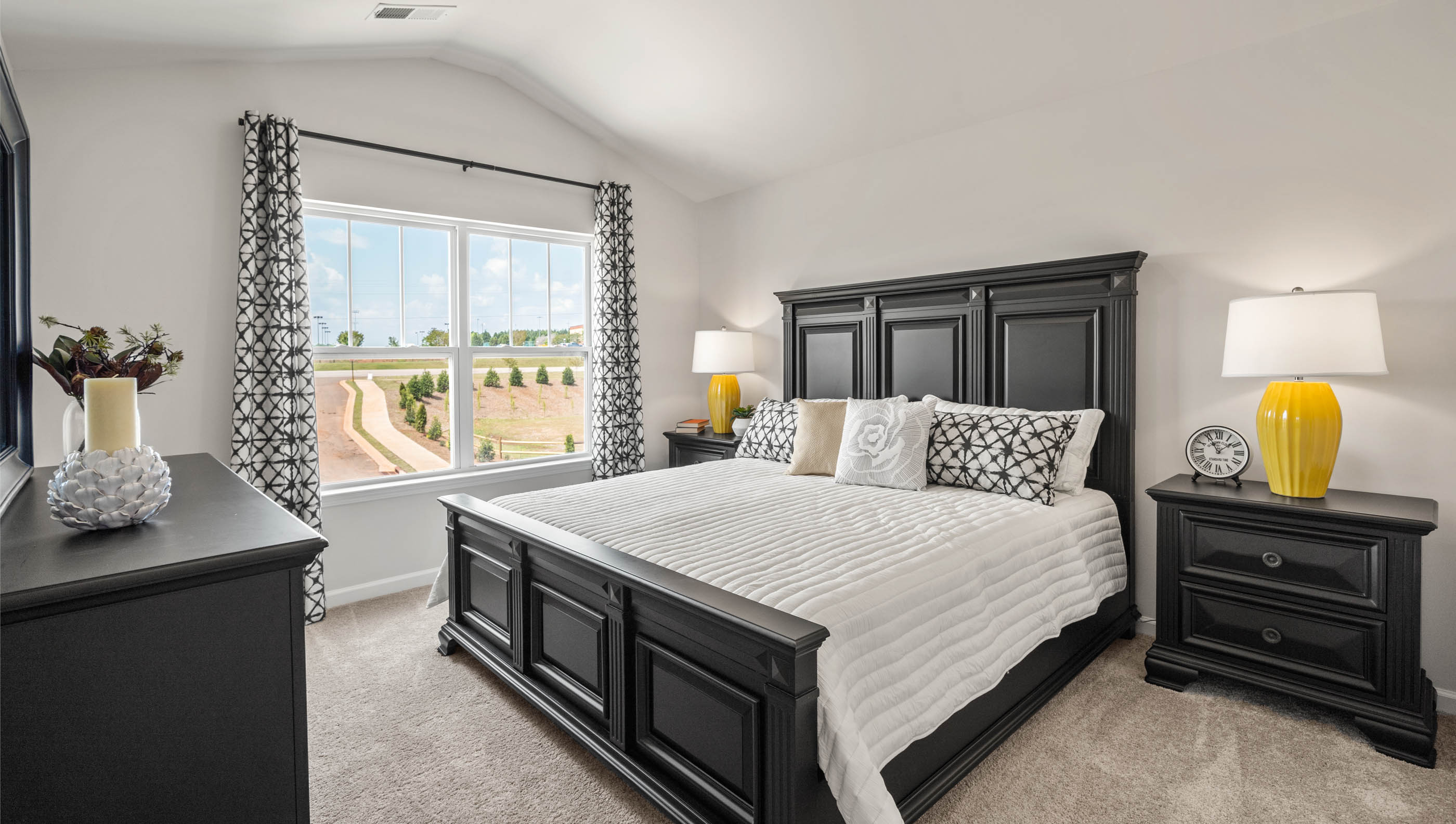 Bedroom with carpet and window.