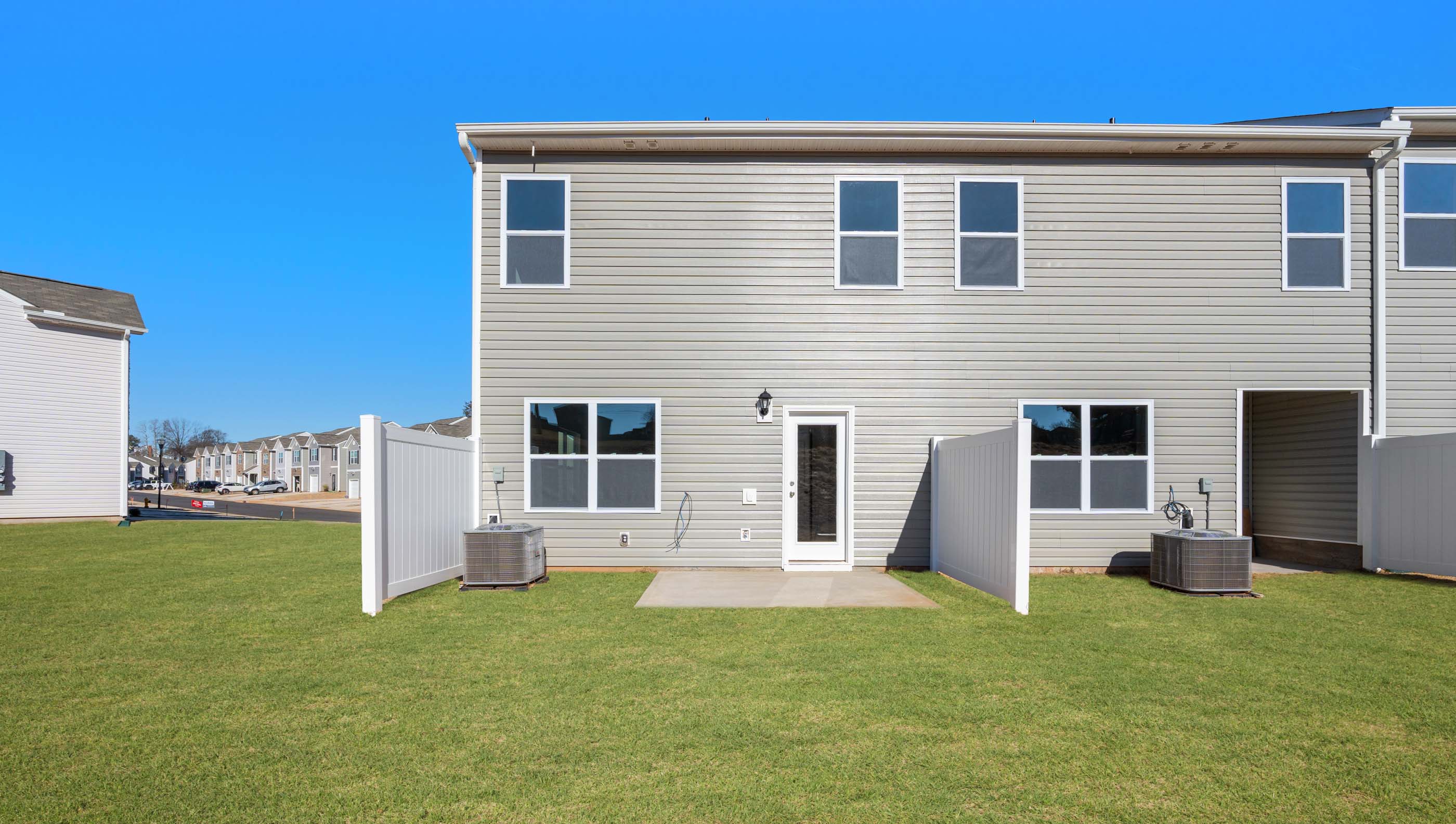 Back exterior view of home and patio.