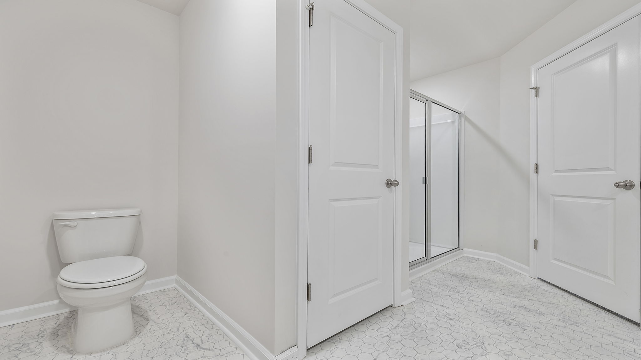 Primary bathroom with walk-in shower.