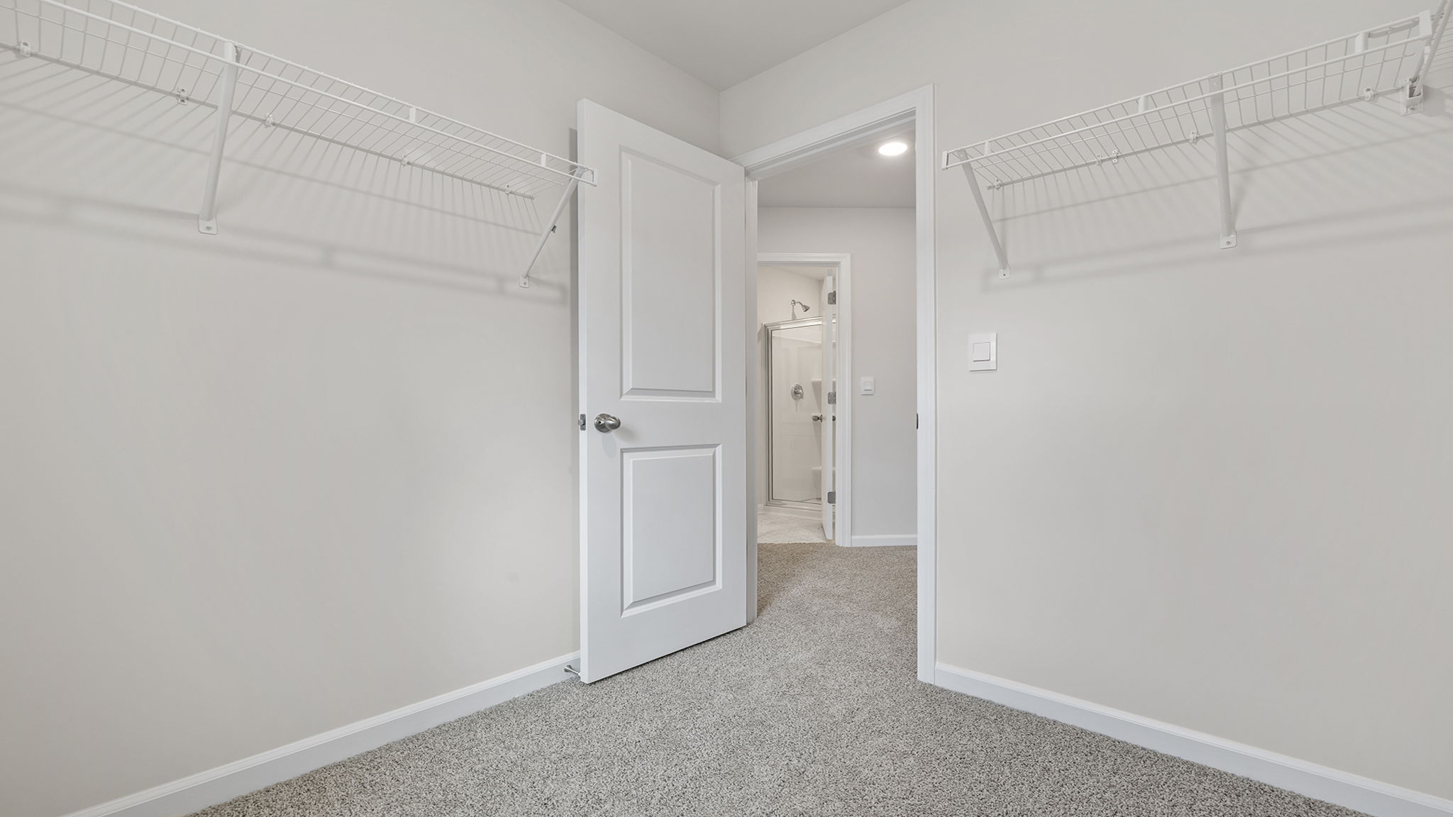 Primary bedroom walk-in closet. Laundry