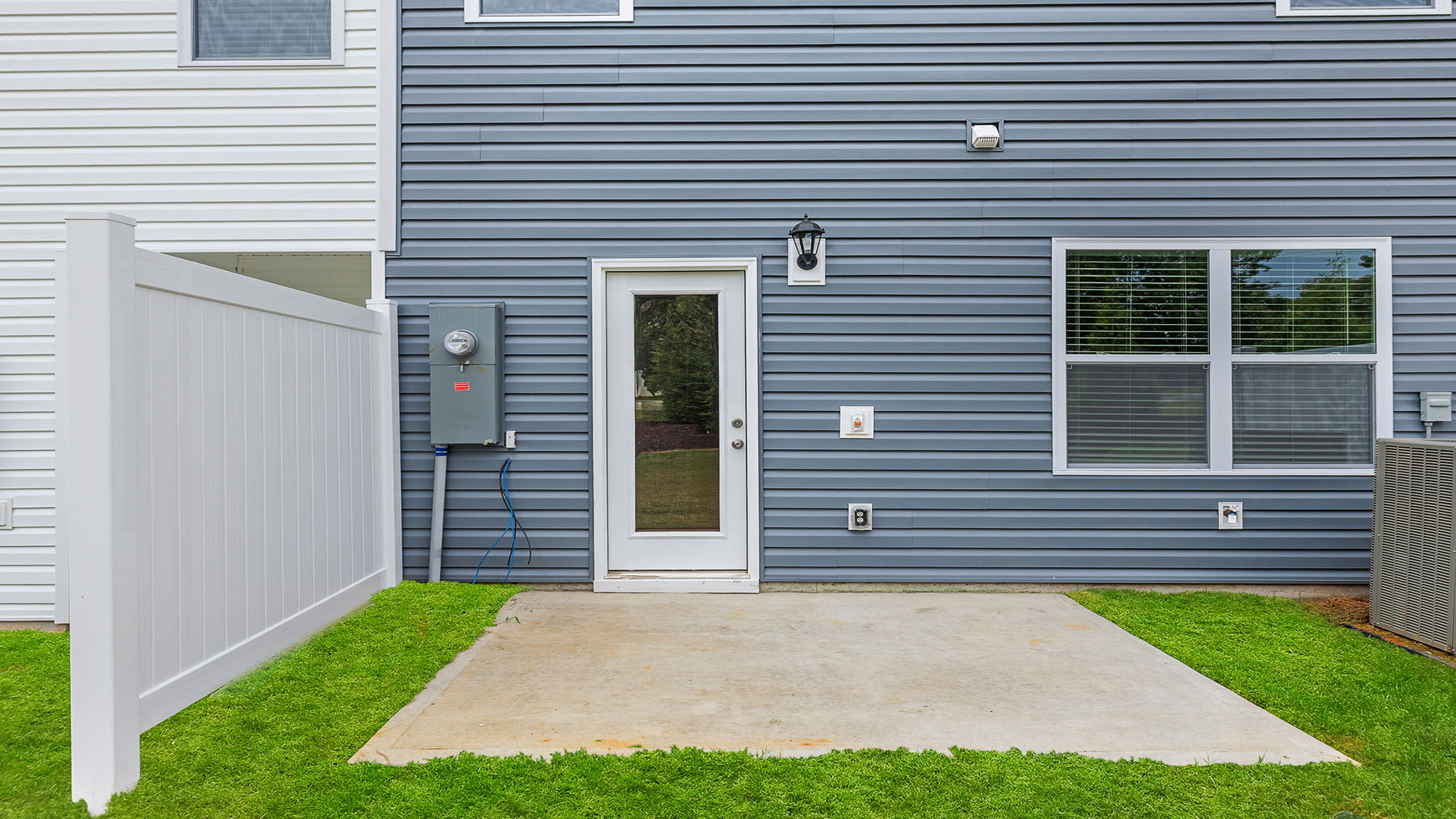 Back exterior view of home and patio.