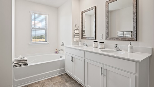 Primary bathroom with double vanity sink.