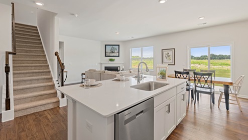 Kitchen with view of stairs.