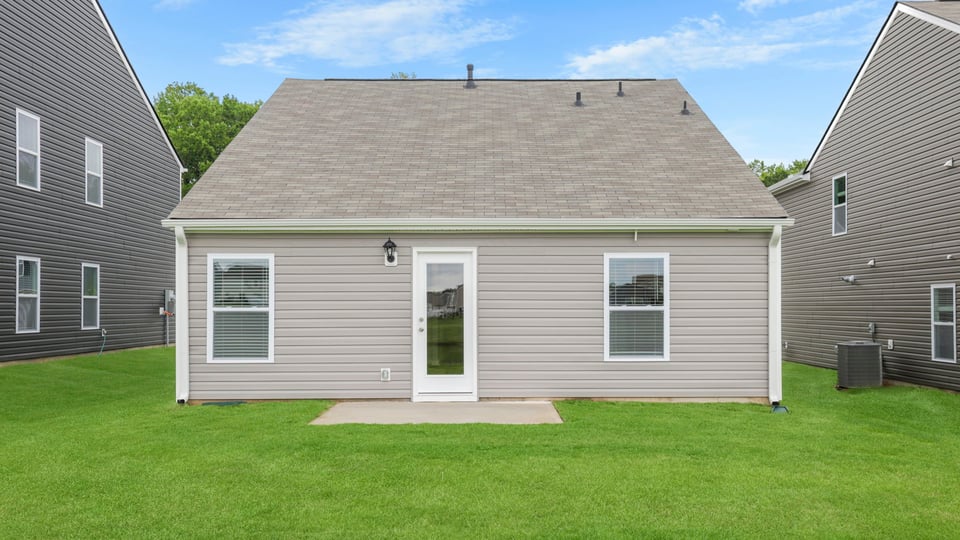 Back exterior with large backyard.