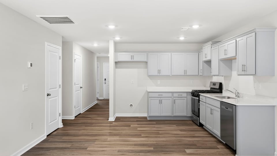 Kitchen with quartz countertops.