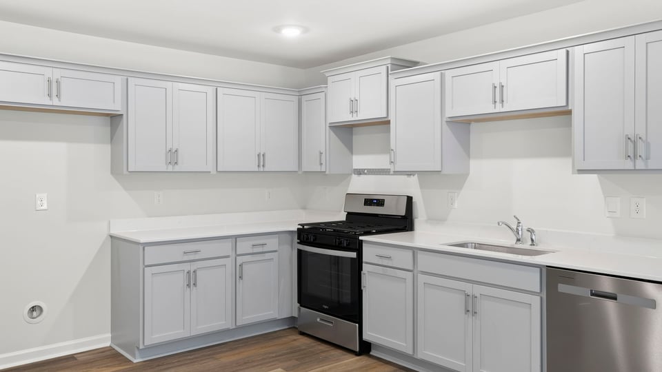 Kitchen with quartz countertops.