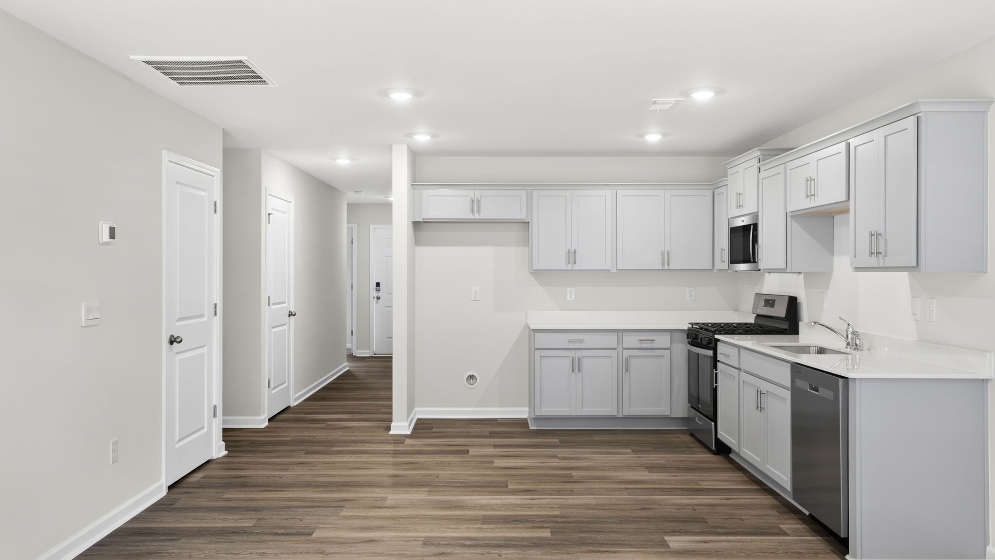 Kitchen with quartz countertops.