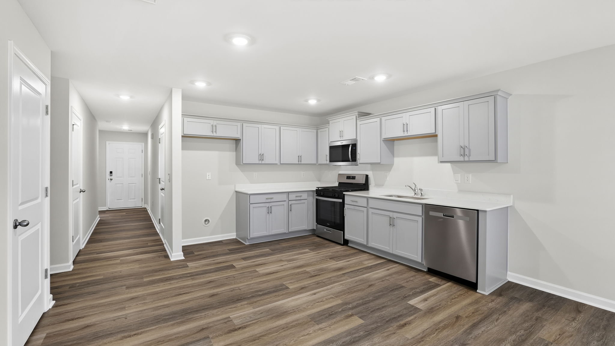 Kitchen with quartz countertops.