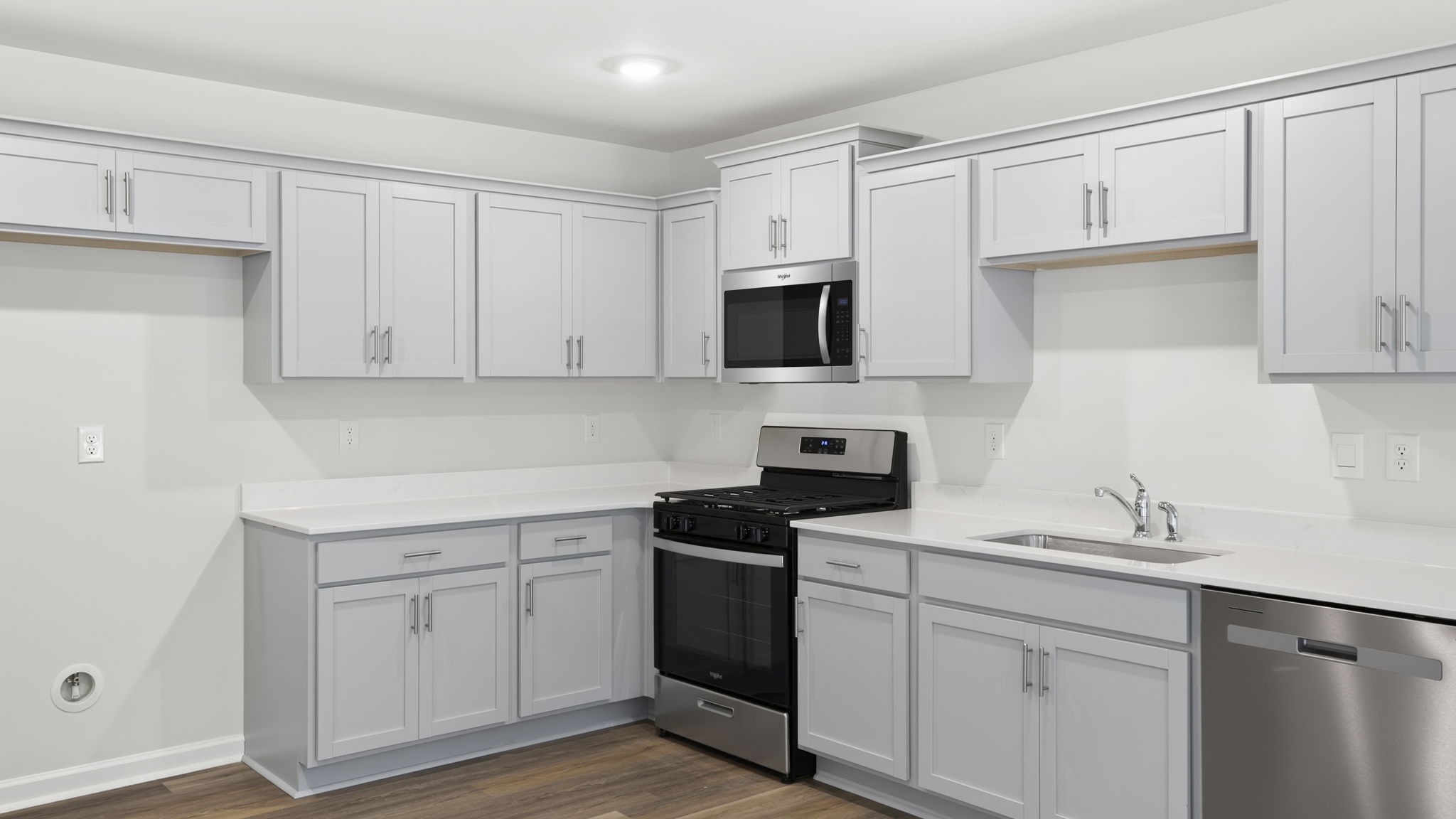 Kitchen with quartz countertops.