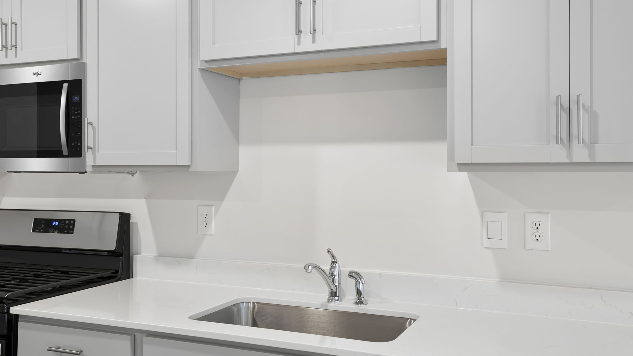 Kitchen with quartz countertops.