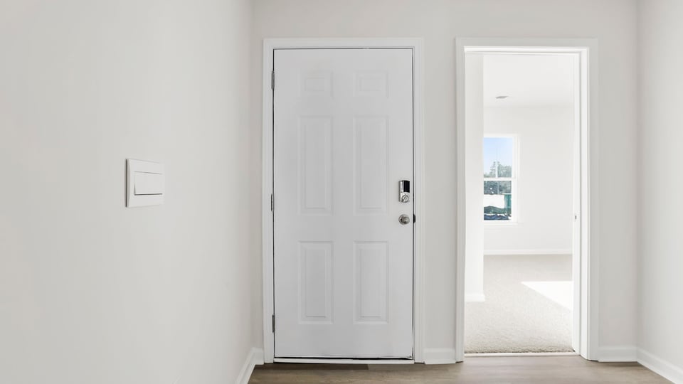 View of entrance and entry to front bedroom.