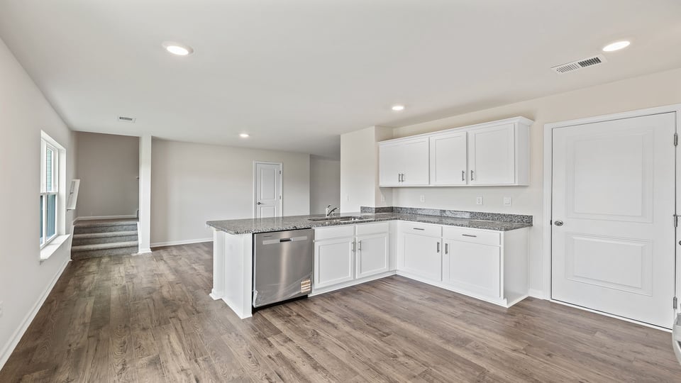 View of back stairwell to the upper level.