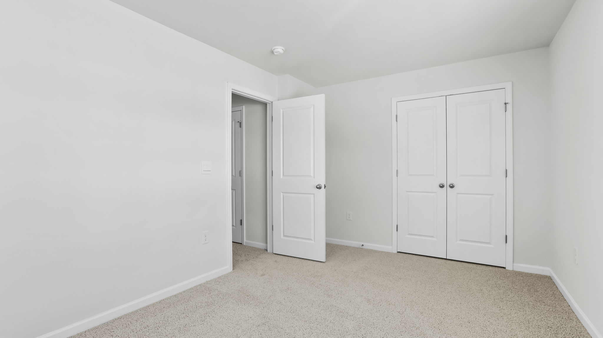 Bedroom with carpet.