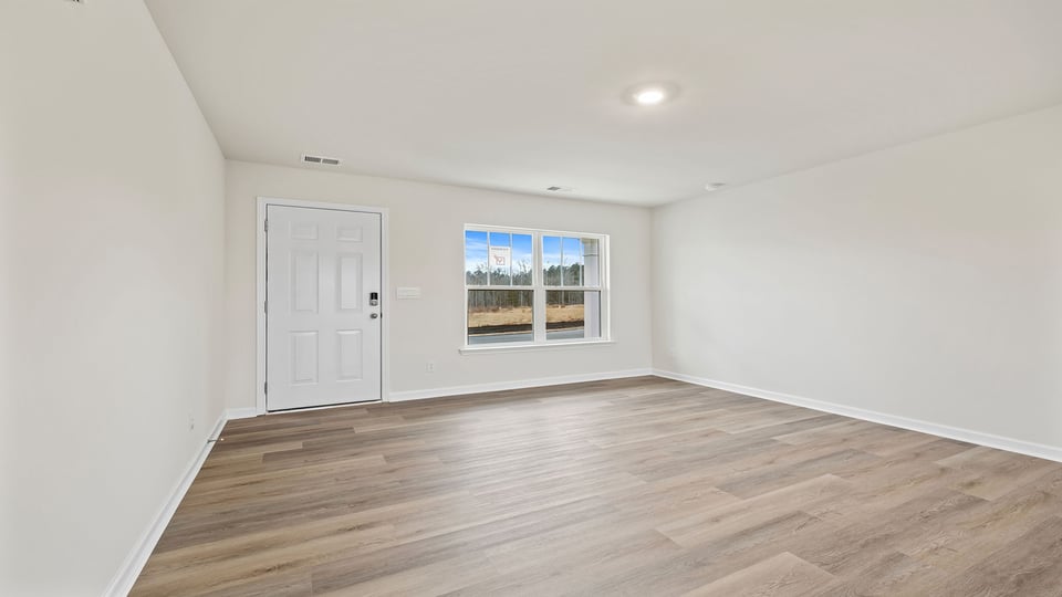 View of the entrance in the family room and the large front window.