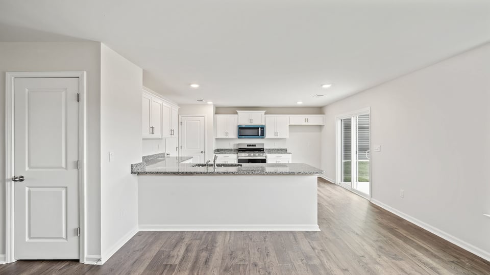 View of kitchen and door to the back yard.