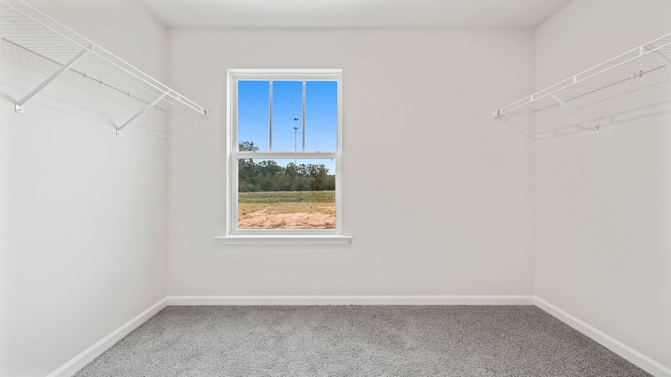 Primary bedroom walk-in closet.
