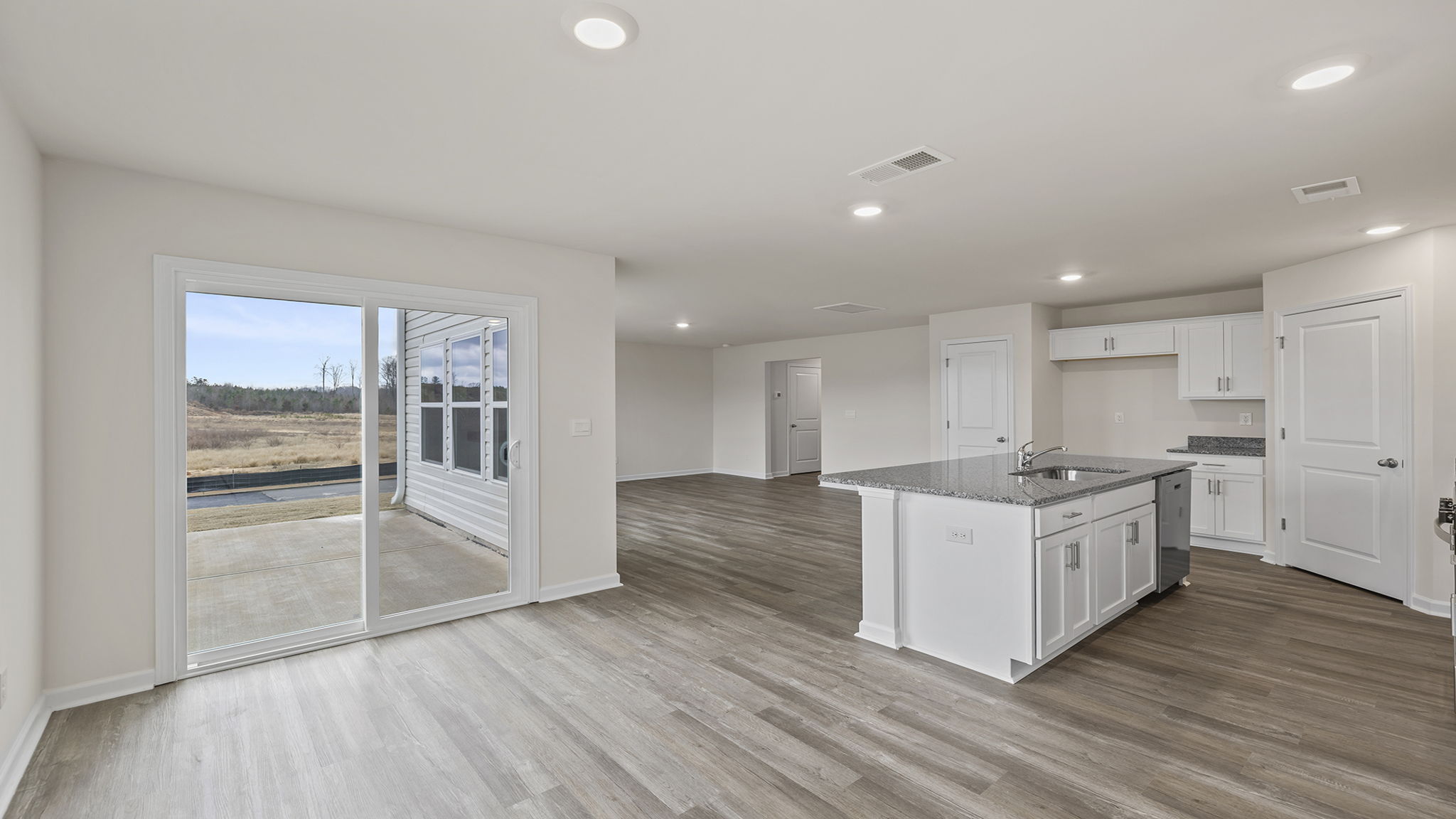 View of open floorplan from breakfast area.