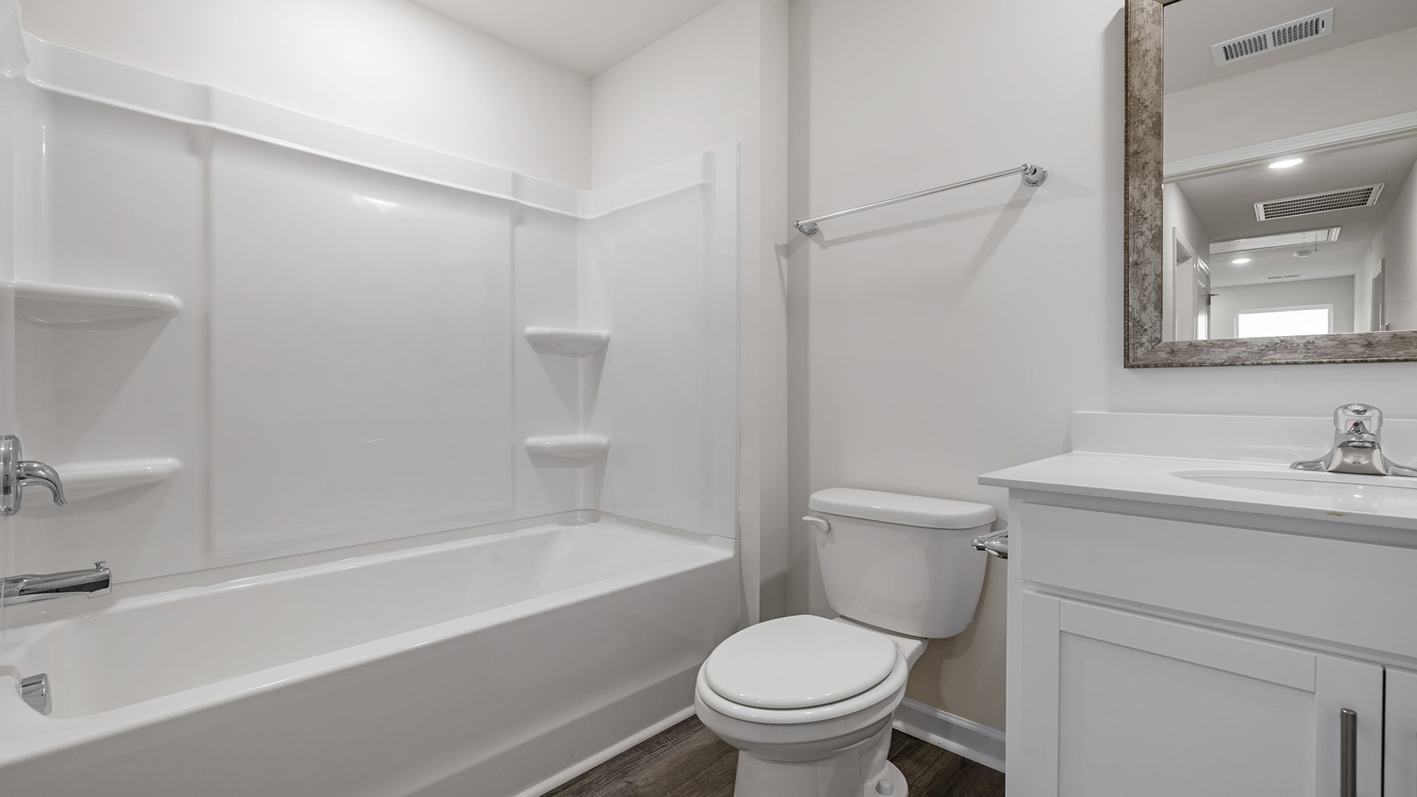 Hall bathroom with vanity and combination shower / tub.