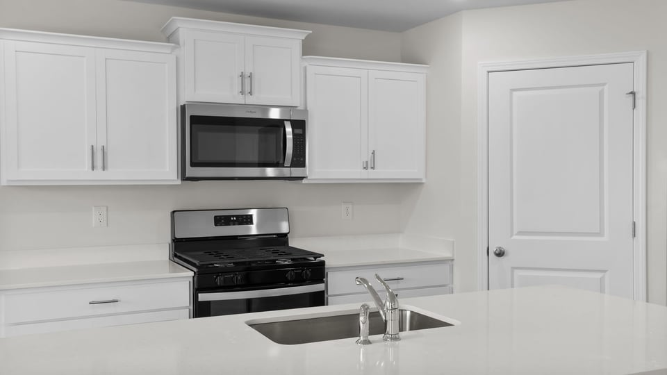 Kitchen with stainless steel appliances.