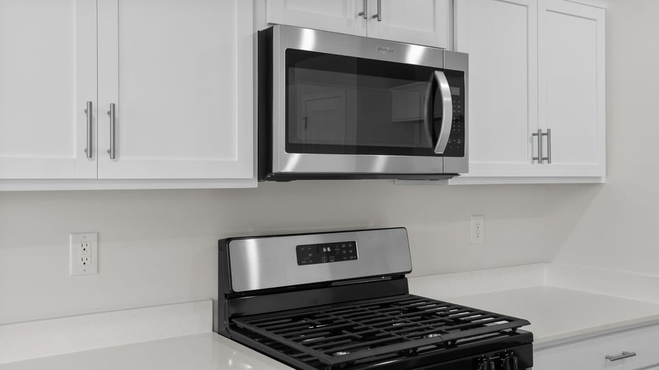 Kitchen with stainless steel appliances.