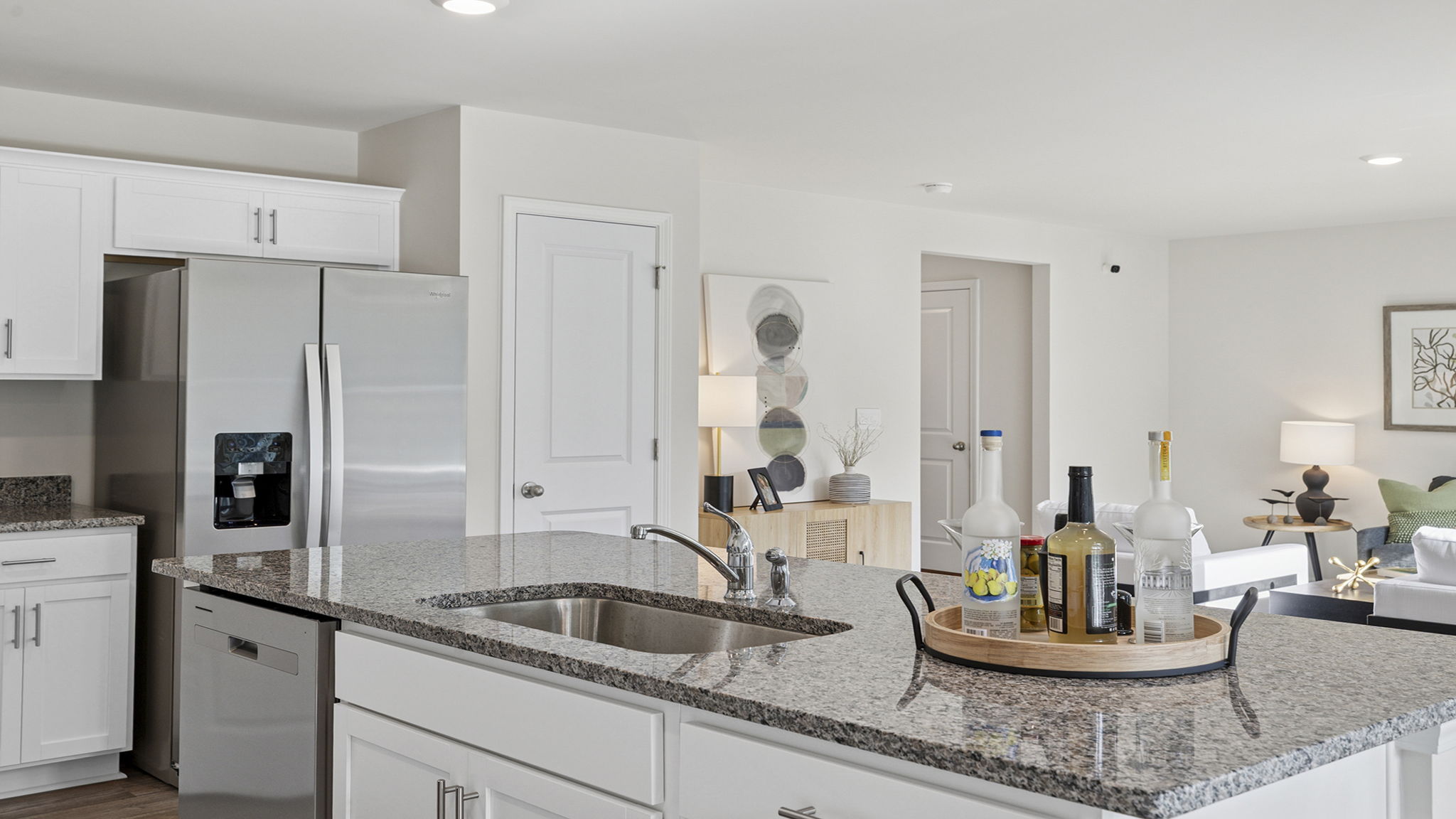 Kicthen with island and cabinets.