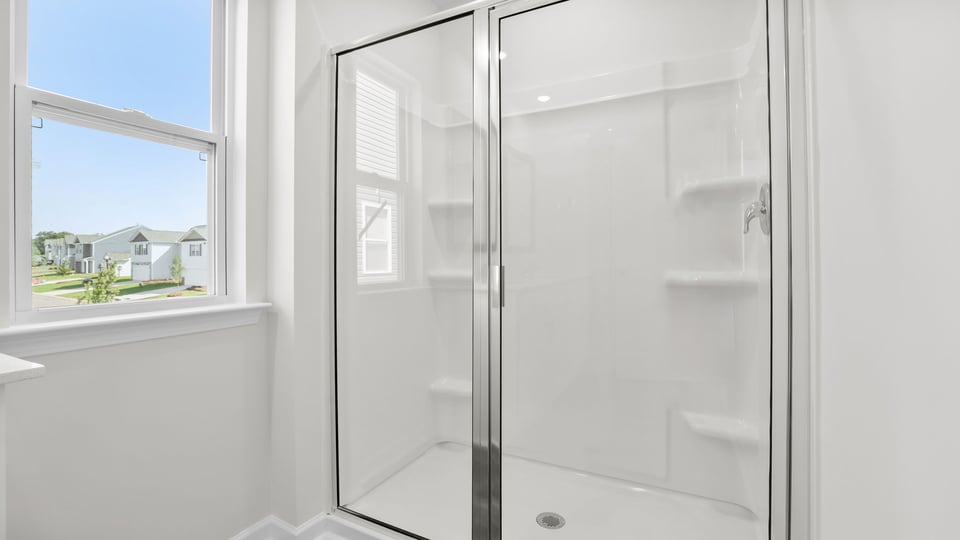Bathroom with walk in shower.