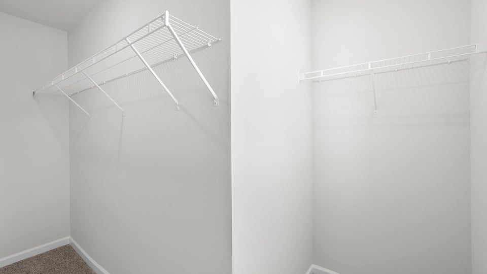 Closet with hanging storage racks.