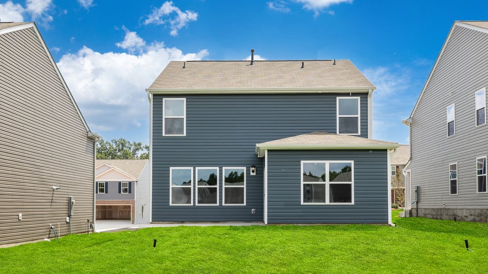 Back exterior with large backyard.