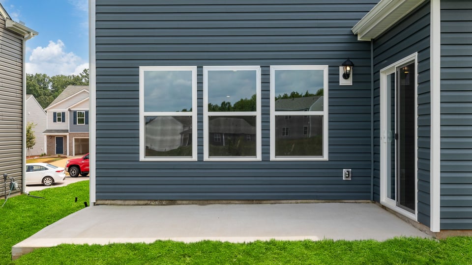 Back exterior with large backyard.