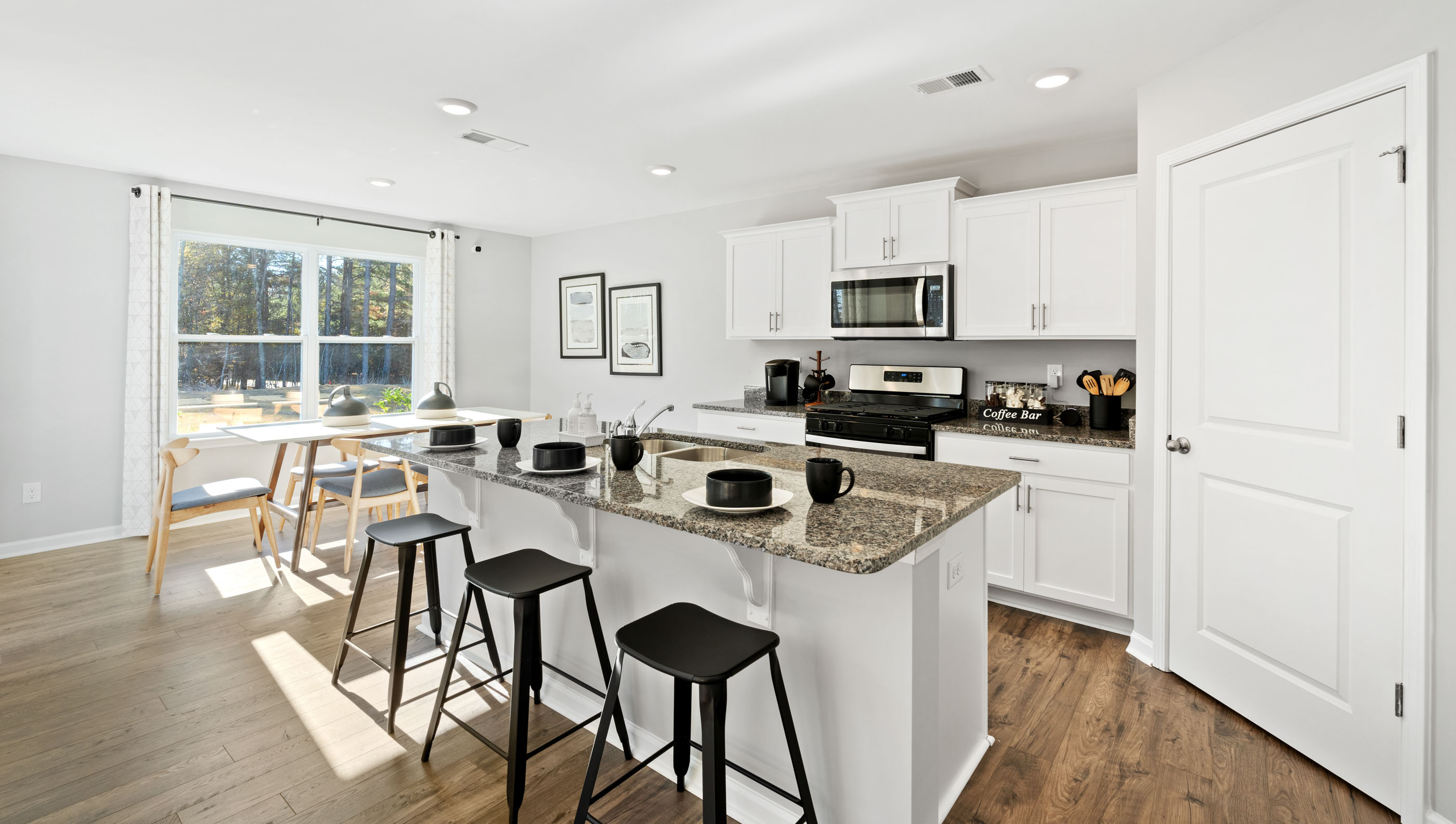 Kitchen and island with granite counter tops.