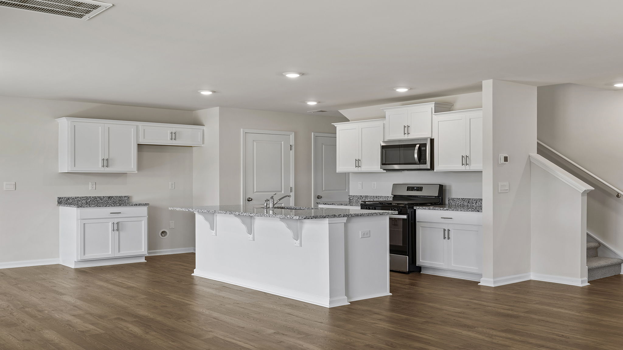 View of kitchen with island.