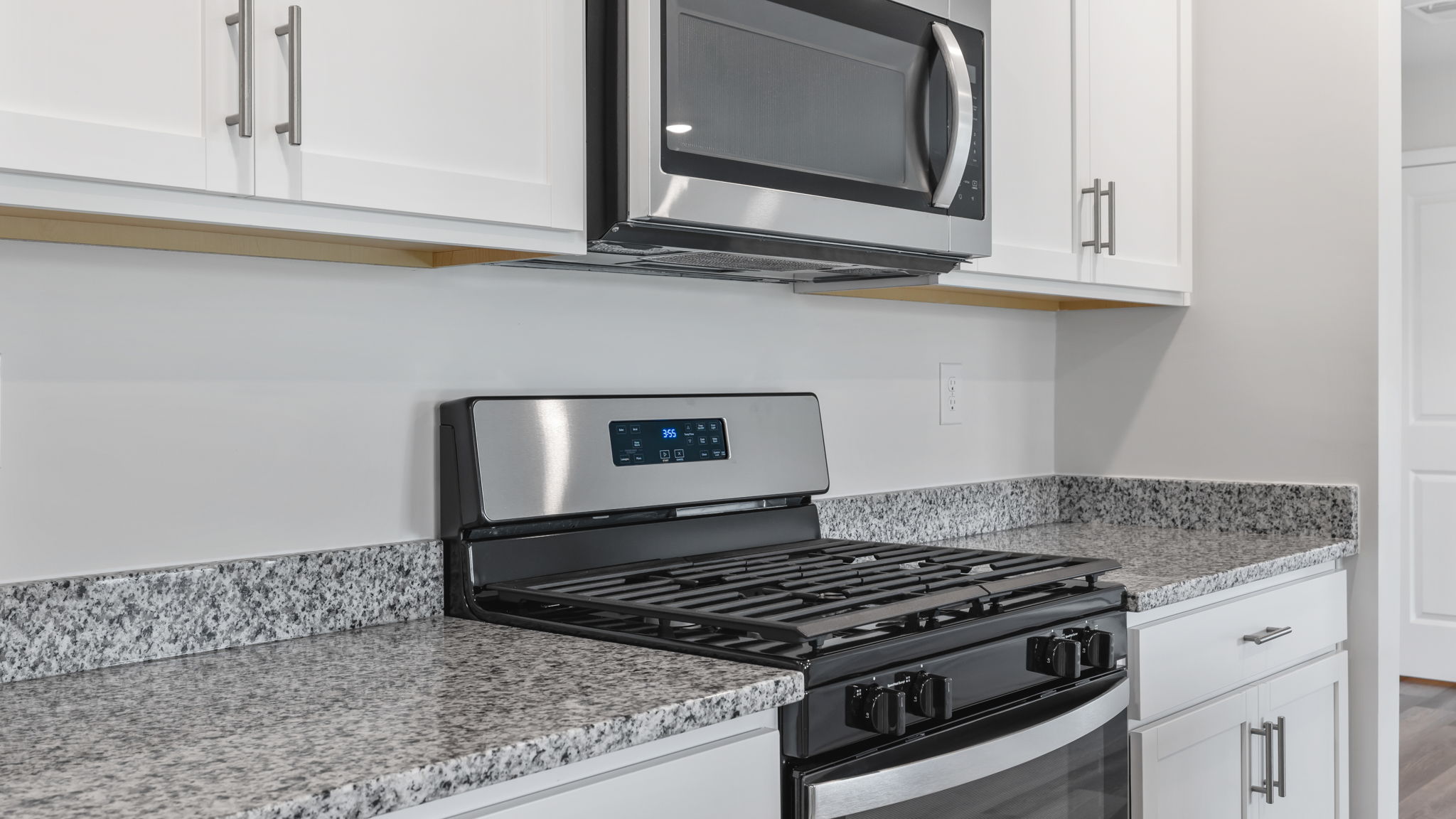 Kitchen features stainless steel appliances.