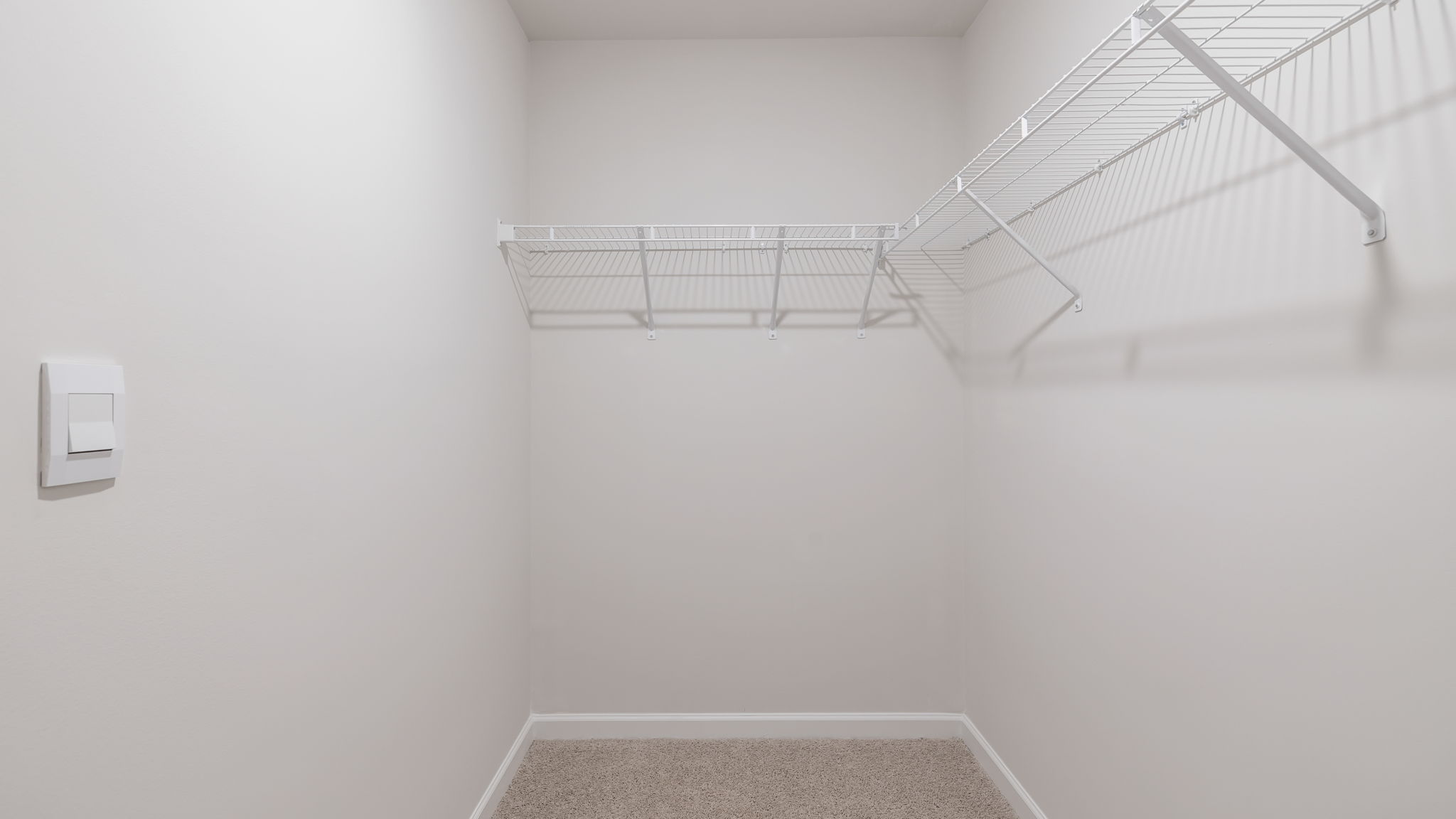 Primary bedroom walk-in closet.
