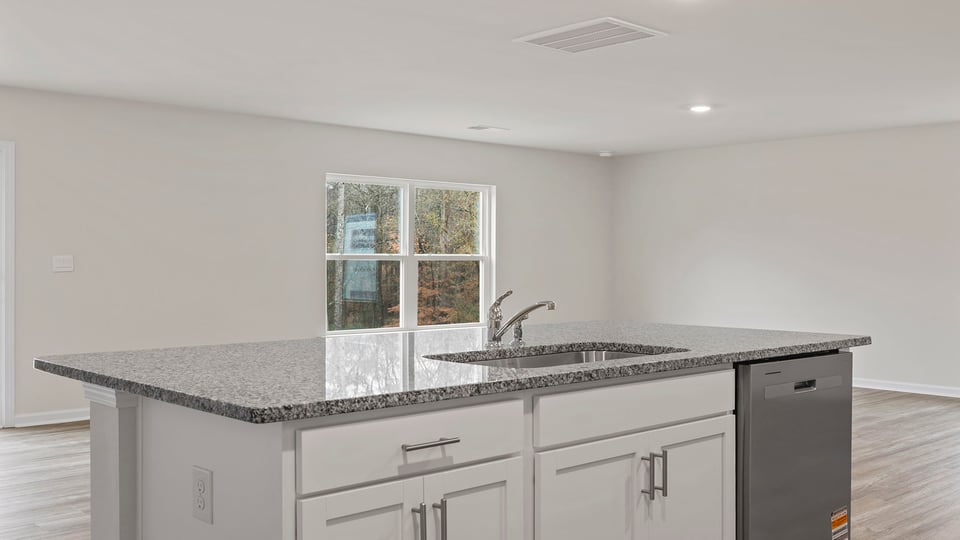 Kitchen with island and cabinets.