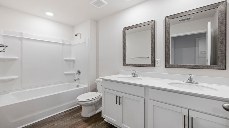 Primary bathroom with double vanity sinks.