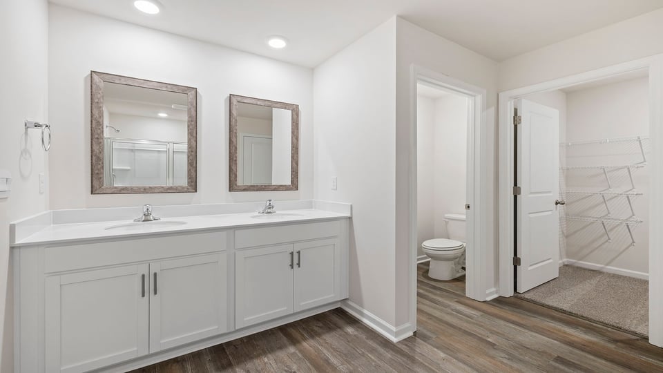 Primary bathroom with double vanity sinks.