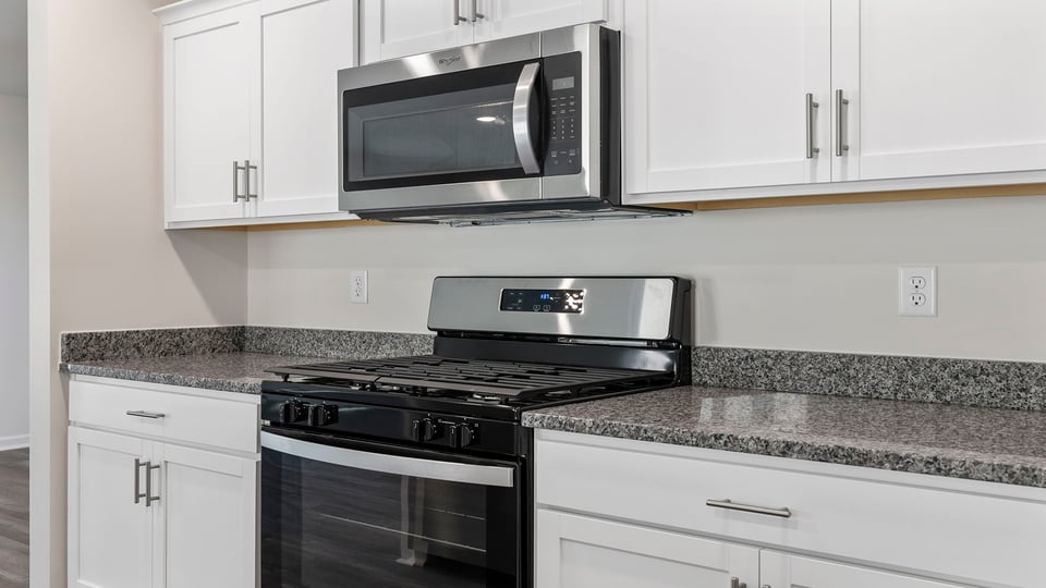 Kitchen has stainless steel appliances.