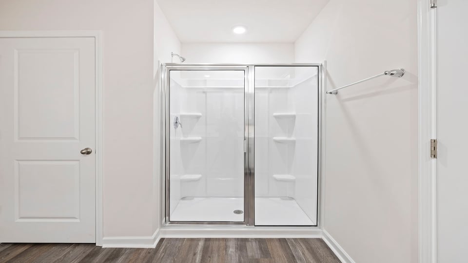 Primary bathroom with walk-in shower.