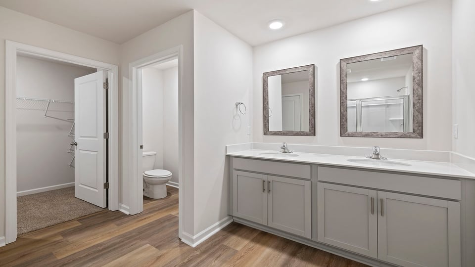 Primary bathroom with dual sink vanity.