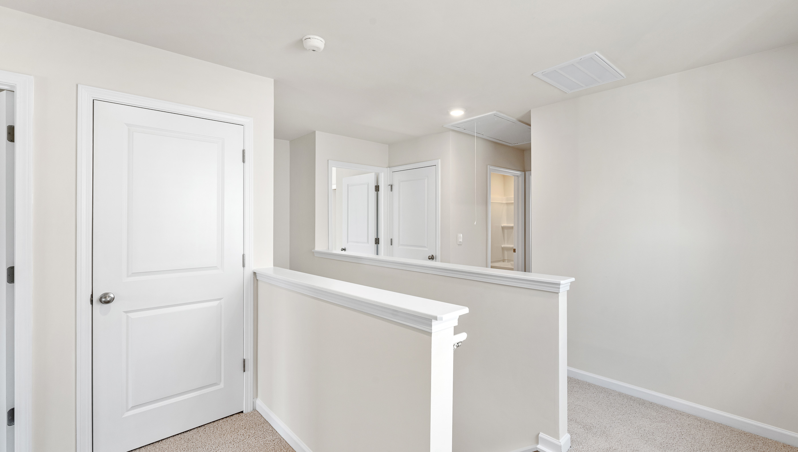 Loft area with carpet.