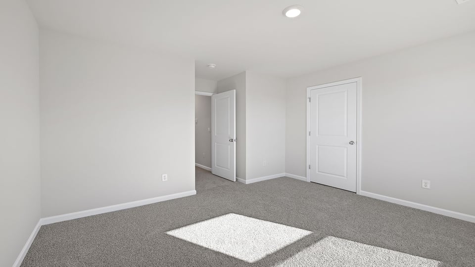 Bedroom with carpet.