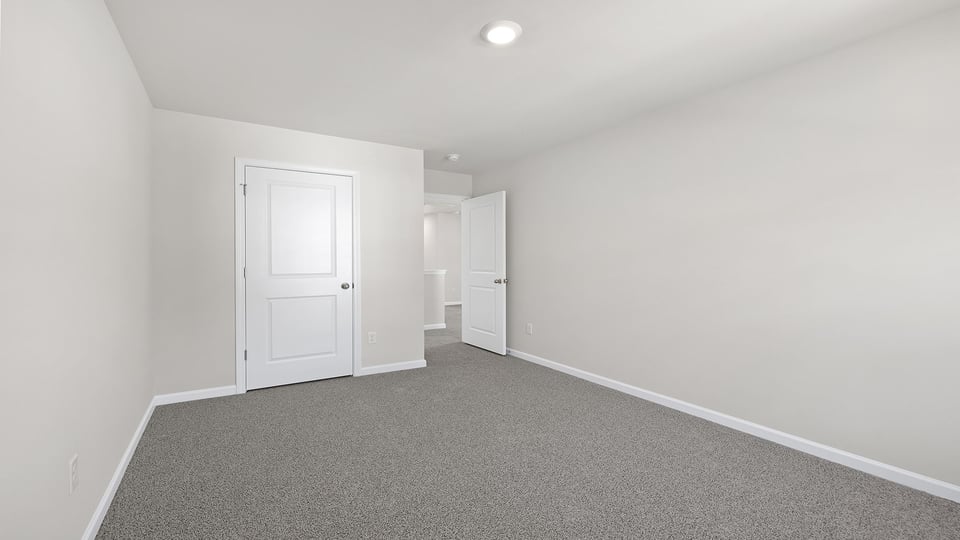 Bedroom with carpet.