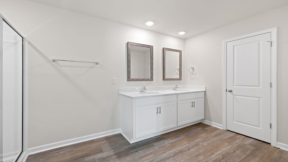 Primary bathroom with dual sink vanity.