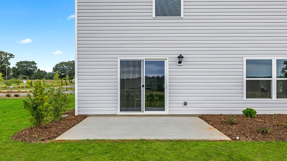 Back exterior with large backyard.