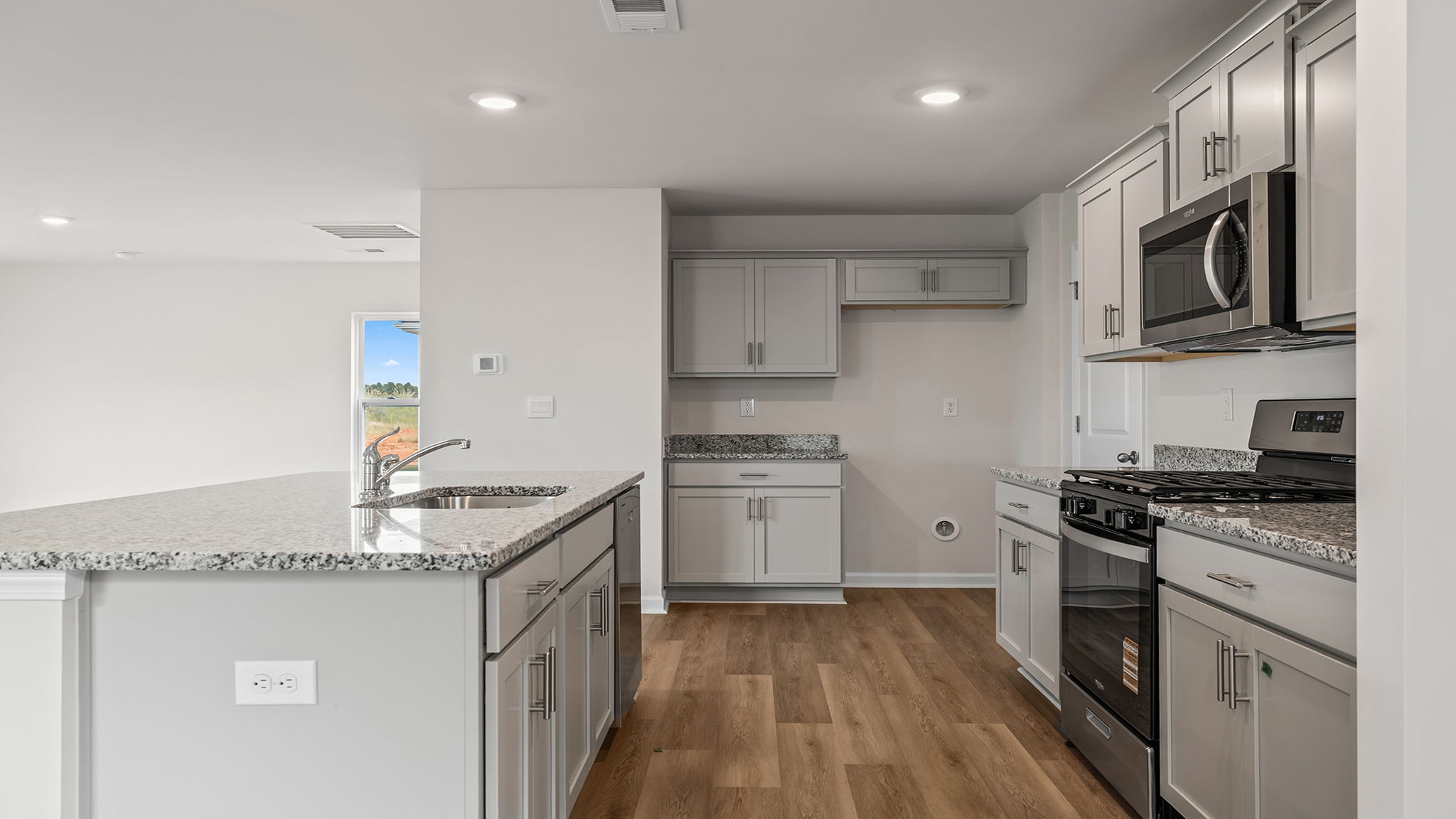 Kitchen with recessed lighting.