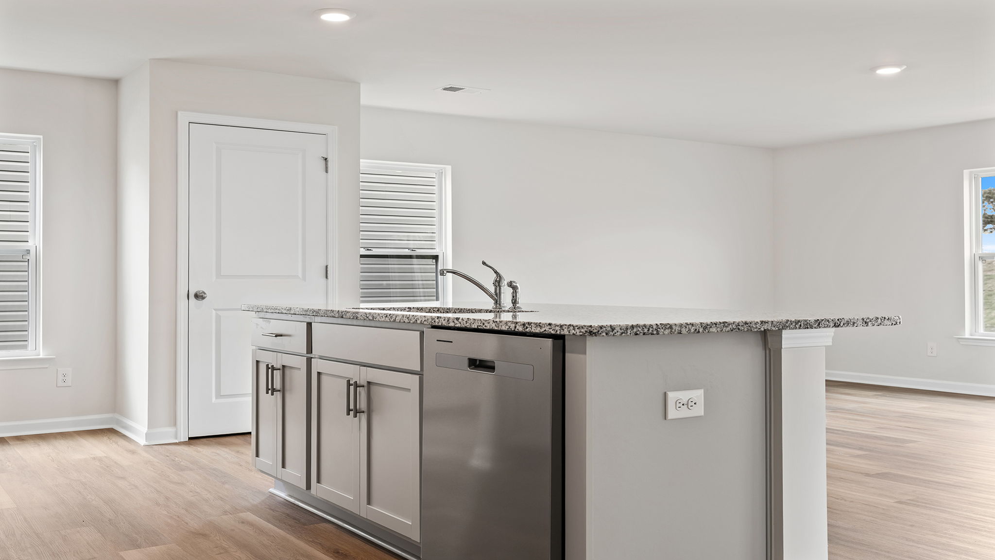 Island hosts the sink and dishwasher.