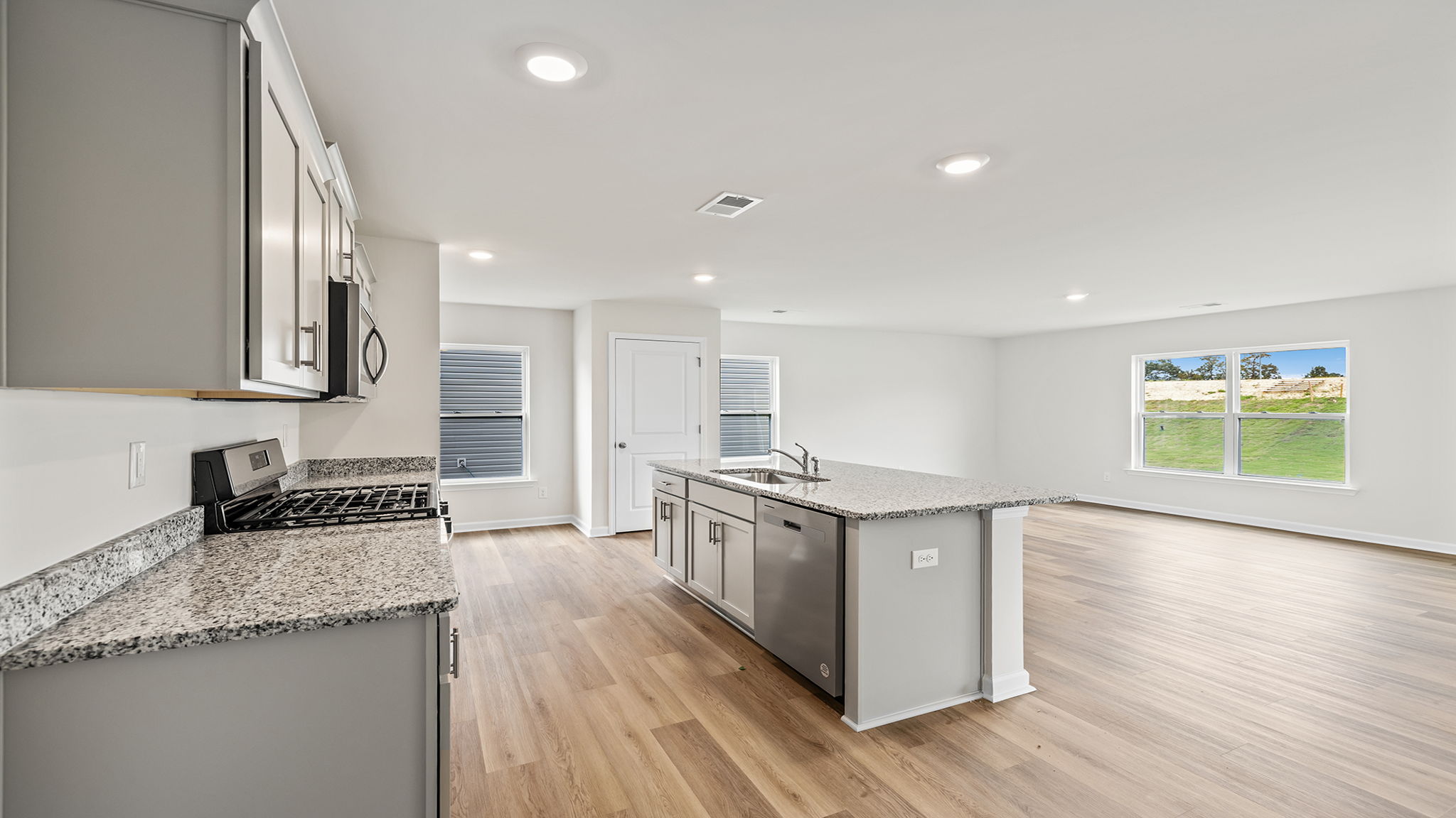 View of open floor plan with lots of windows.