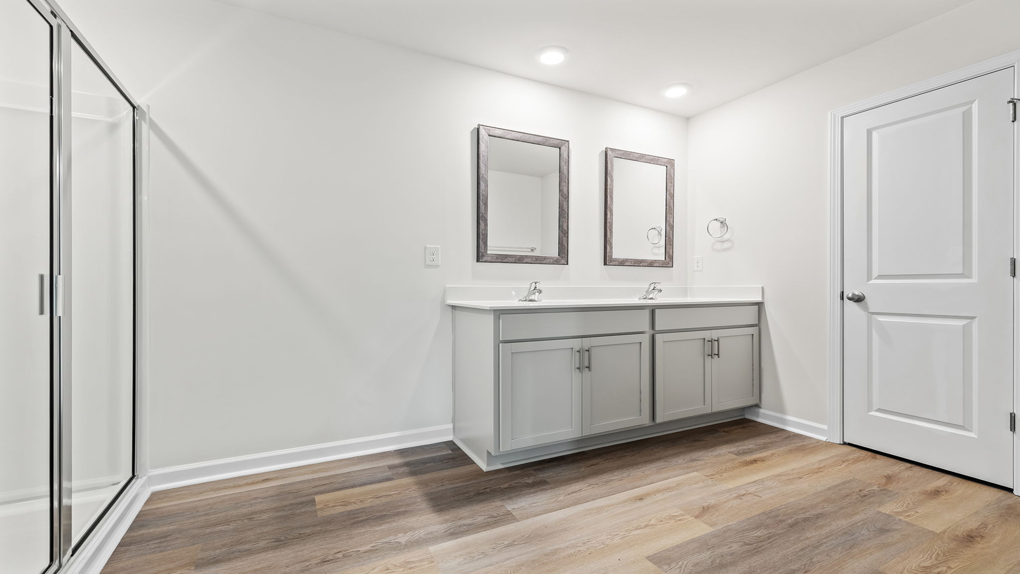 Primary bathroom with dual sink vanity.